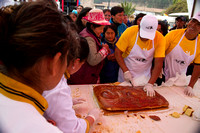Crowd gathers for "Tantawawa" bread in Cuzco, Peru